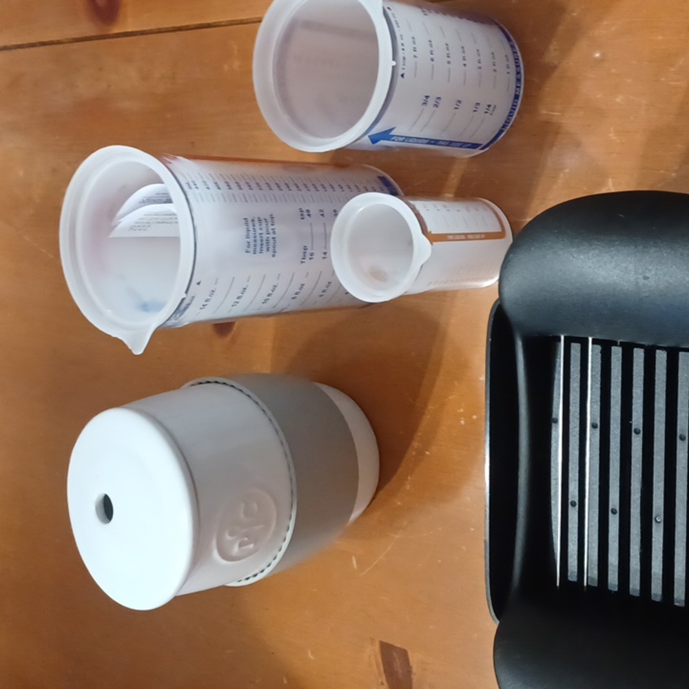 Lot of pampered. chef lg diser 2 push. Up measuring cups microwave egg cooker wi